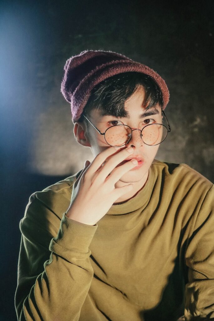 Photo by Kawin Harasai man in brown crew-neck sweatshirt with brown beanie